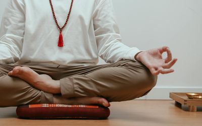 Close-up of hands in a meditative gesture.